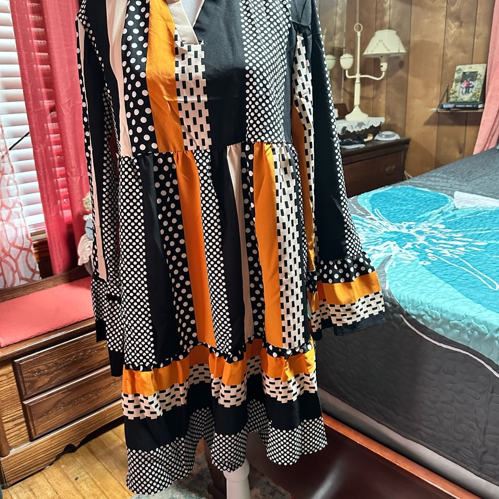 Woman’s midi dress can be worn with leggings or alone beautiful fall colors